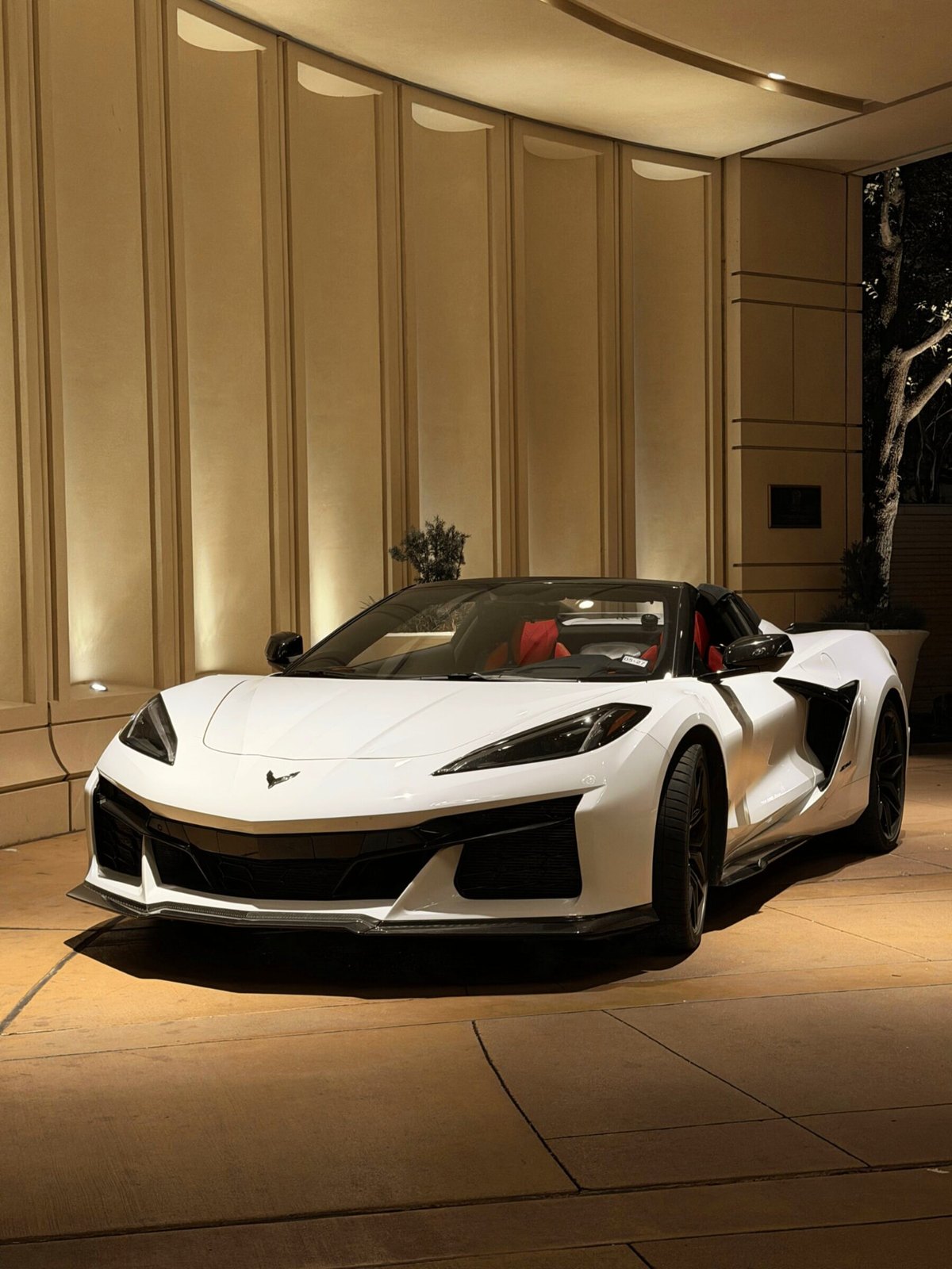 Corvette Z06 3LT supercar rental parked at night in Dallas–Fort Worth